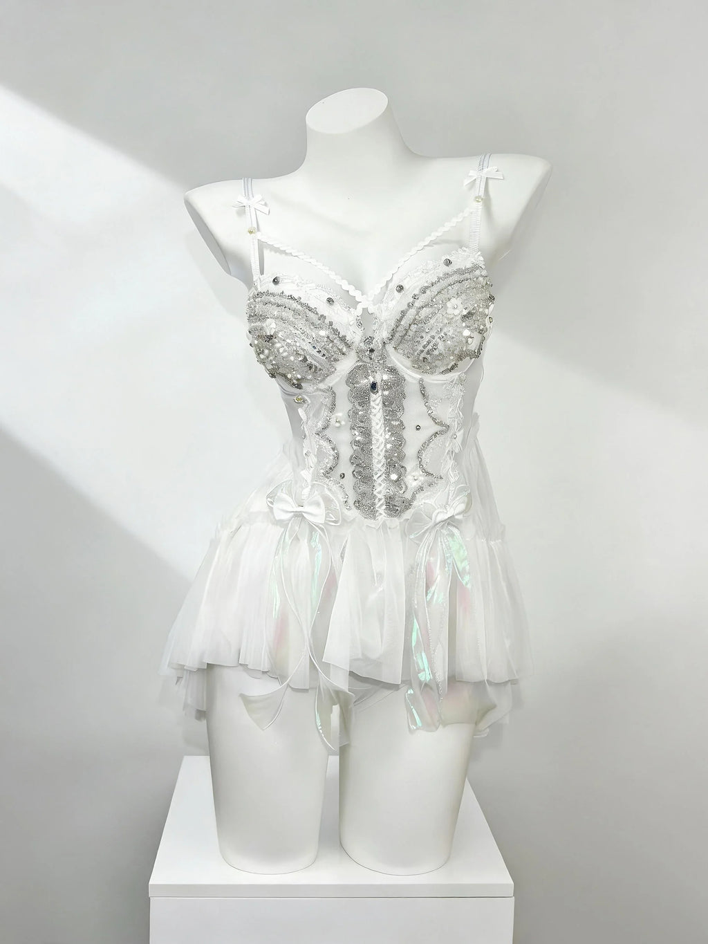 White fantasy rave outfit with layered tulle details by AVRY