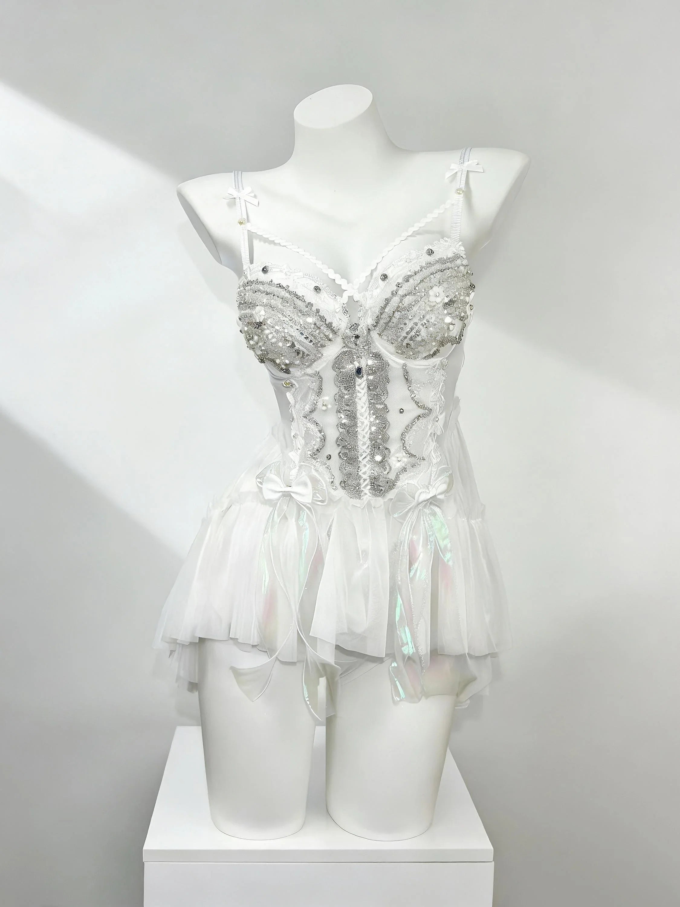 White fantasy rave outfit with layered tulle details by AVRY