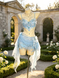 Front view of the Seraphina Eirlys ice blue butterfly festival set By AVRY featuring crystal embellishments, lace draping, pearl chains and matching skirt.