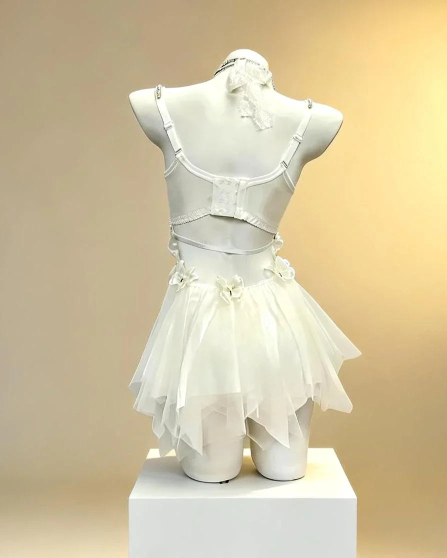 AVRY Aurora Moth back view showing white mesh textures, soft draped accents and ethereal festival outfit details.