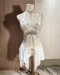 AVRY Aurora Moth white butterfly rave outfit with corset top, matching bottom and pearl chain details.
