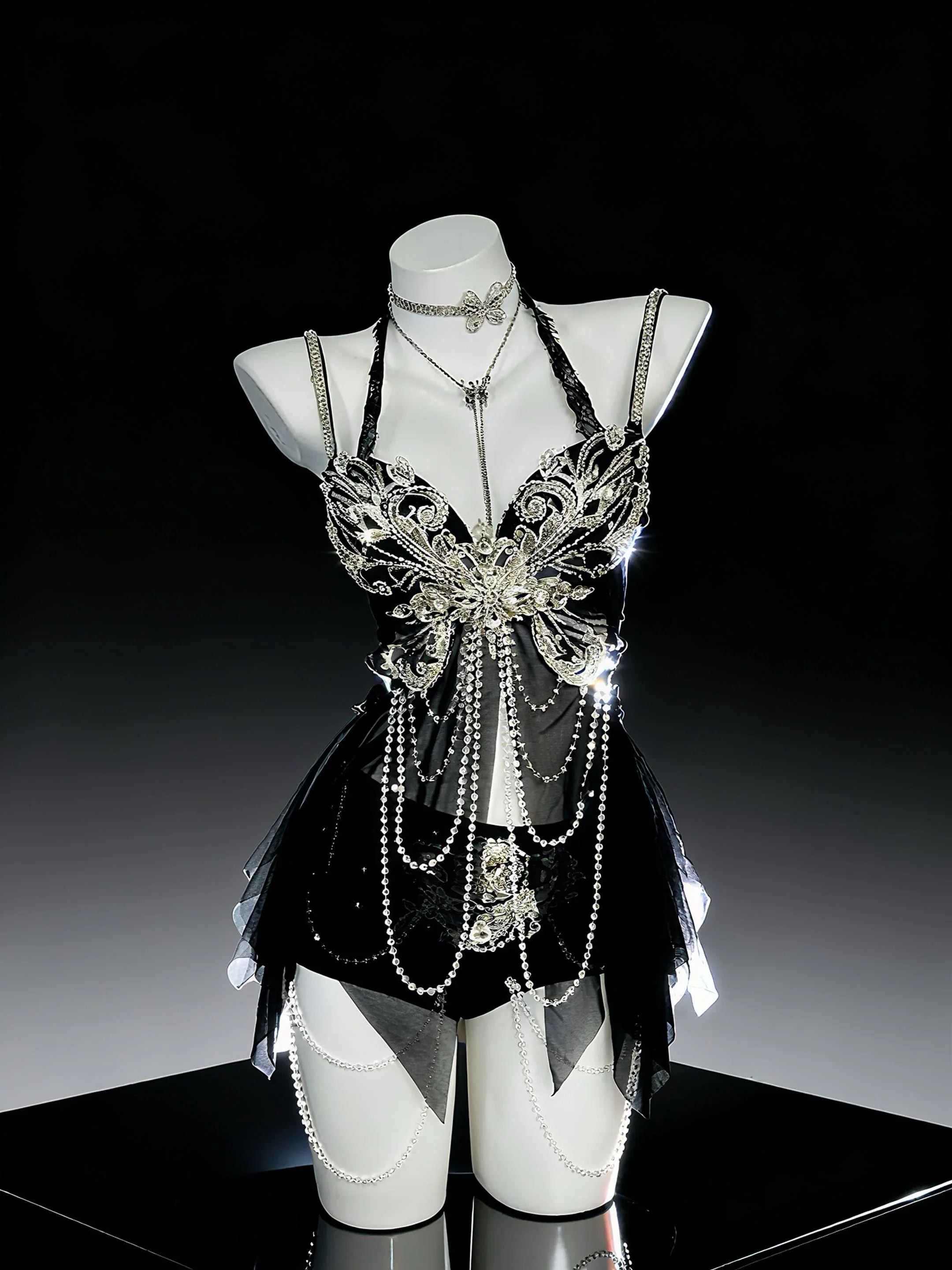 AVRY Noir Monarch black gothic rave outfit with corset top, bottom and necklace for dark fairy festival styling.