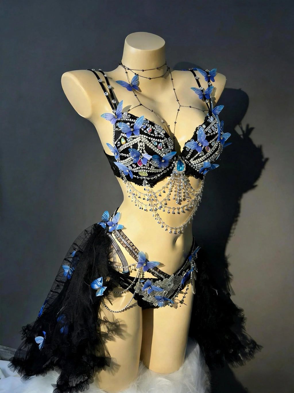 AVRY Azure Morpho Seraphina collection front view with blue butterfly details, crystal chains and dark fairy styling.