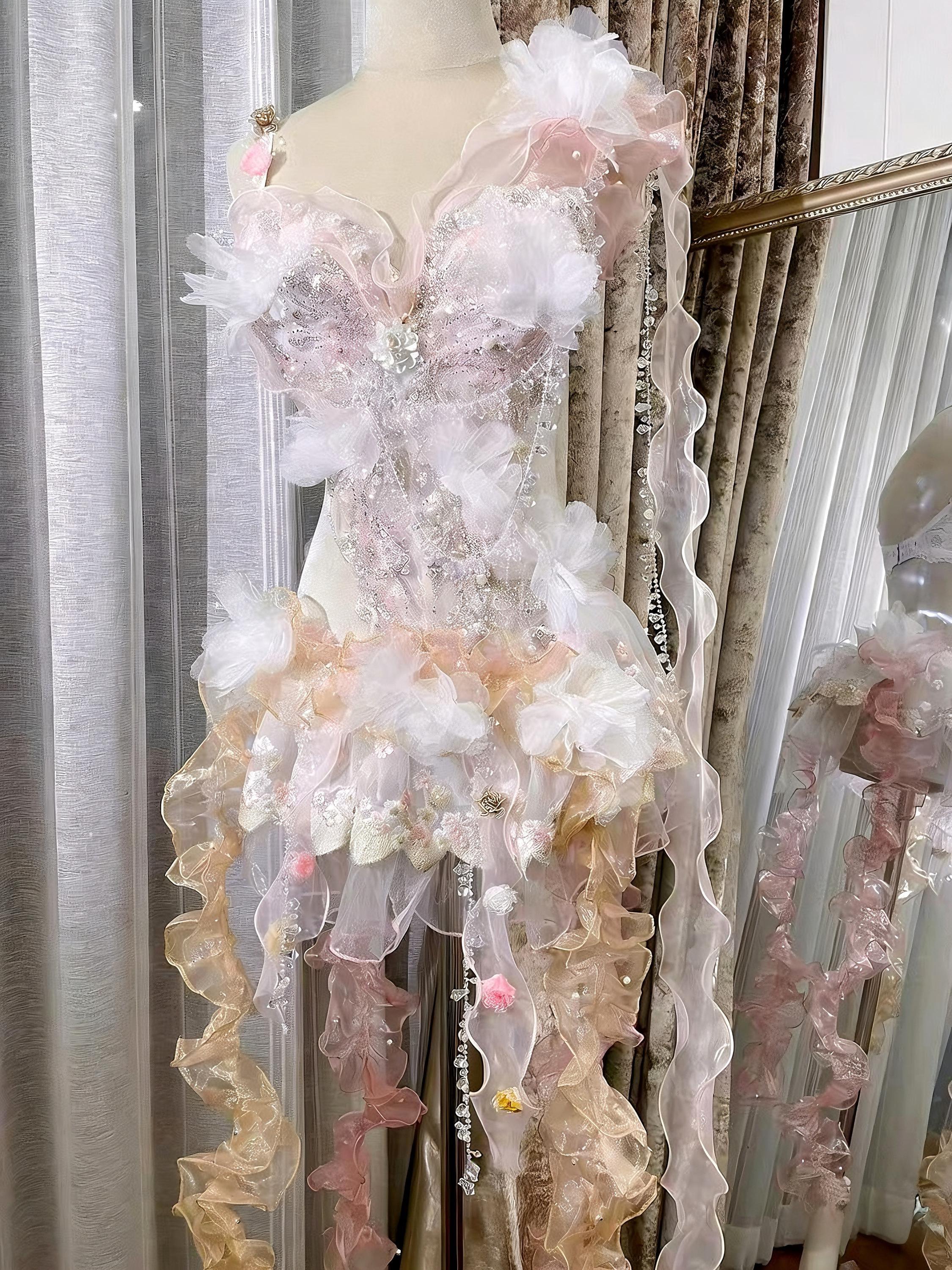 AVRY Camellia Set pastel fairy rave bodysuit with floral details, organza ruffles and flowing ribbon accents.
