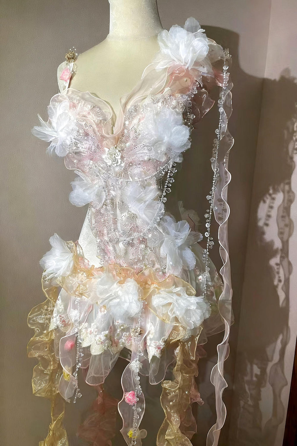 AVRY Camellia Set side view with pastel ruffles, flowing ribbons and ethereal festival outfit details.