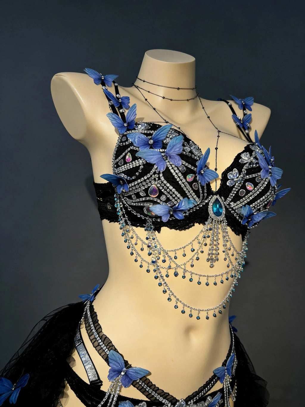 AVRY Azure Morpho close-up detail with blue butterfly appliqués, crystal embellishments and festival rave styling.