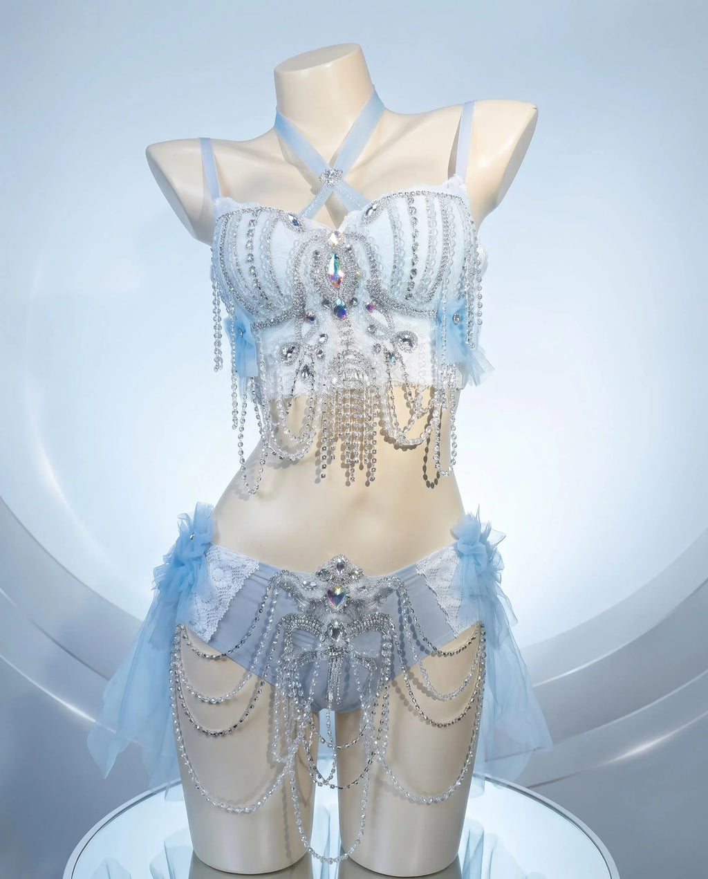 AVRY Dovea Set Aether Plume collection front view with pearl chain details, crystal accents and feather styling.