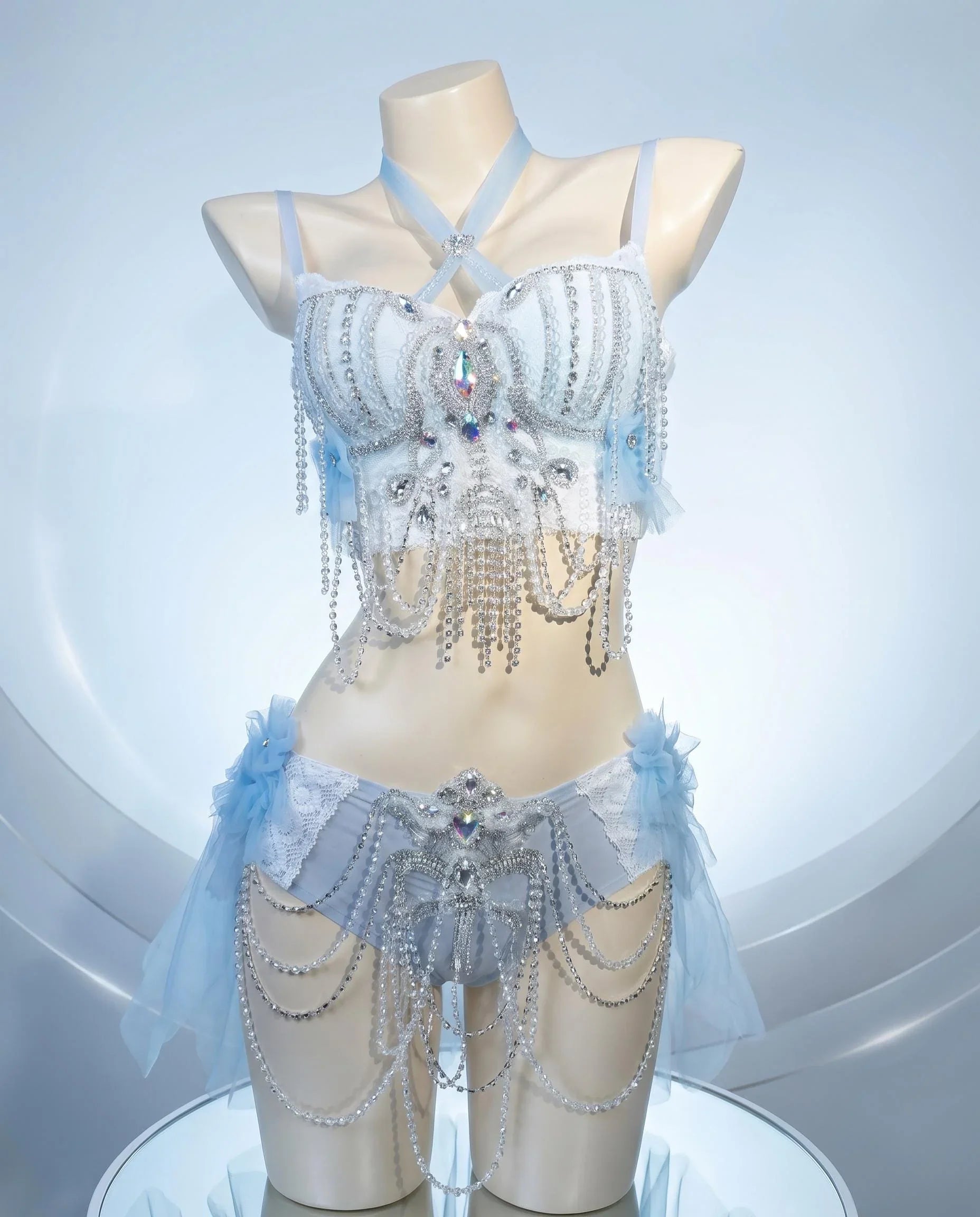 AVRY Dovea Set Aether Plume collection front view with pearl chain details, crystal accents and feather styling.
