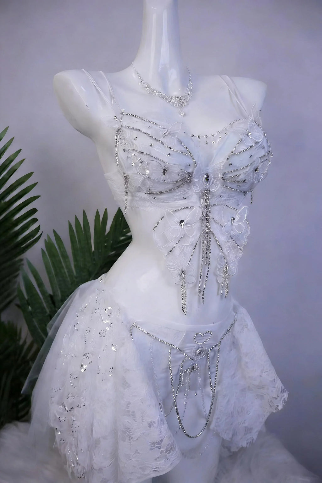 AVRY Lilac Morpho Seraphina collection front view with white butterfly wings, crystal details and fairycore rave styling.