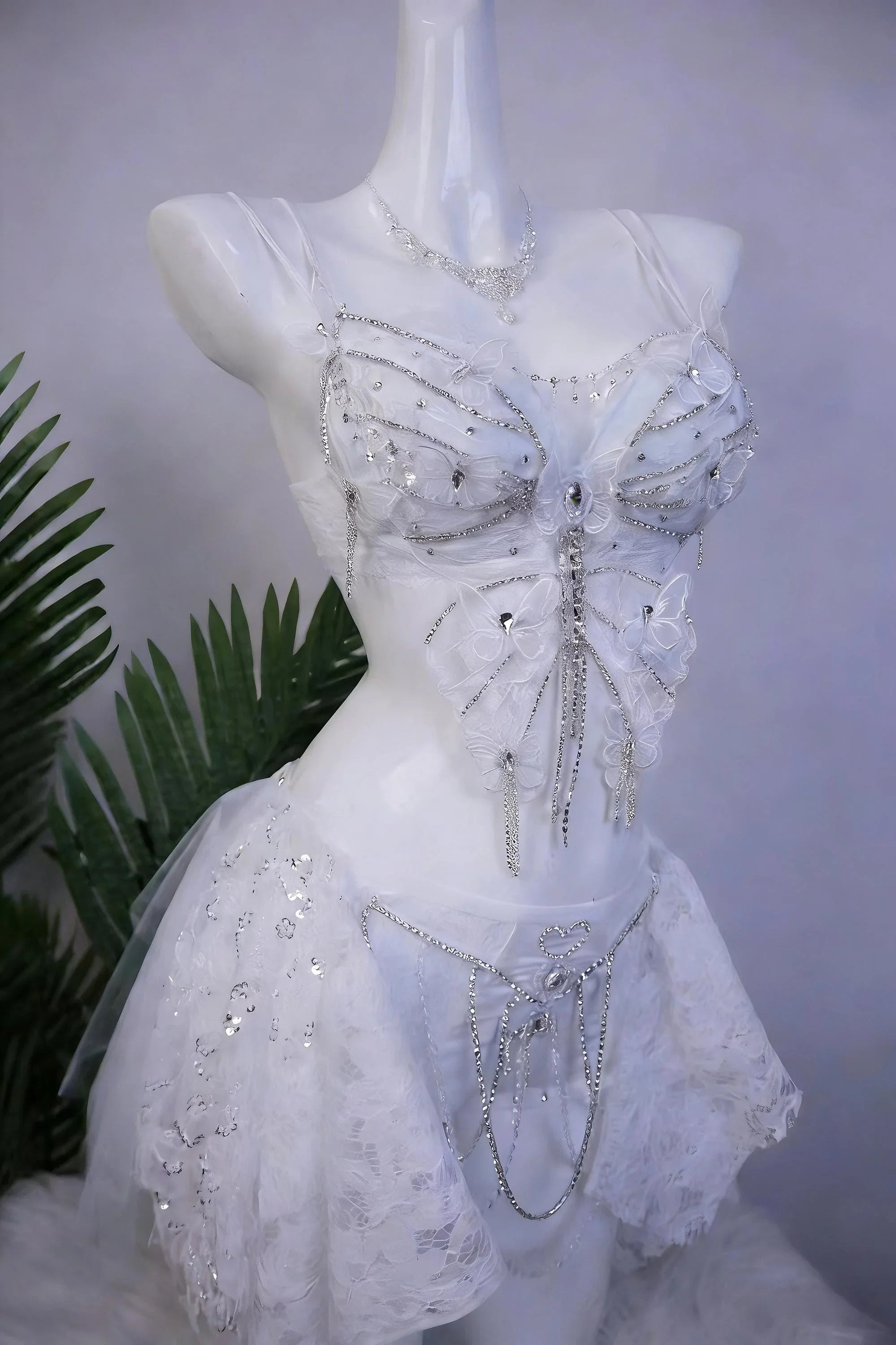 AVRY Lilac Morpho Seraphina collection front view with white butterfly wings, crystal details and fairycore rave styling.
