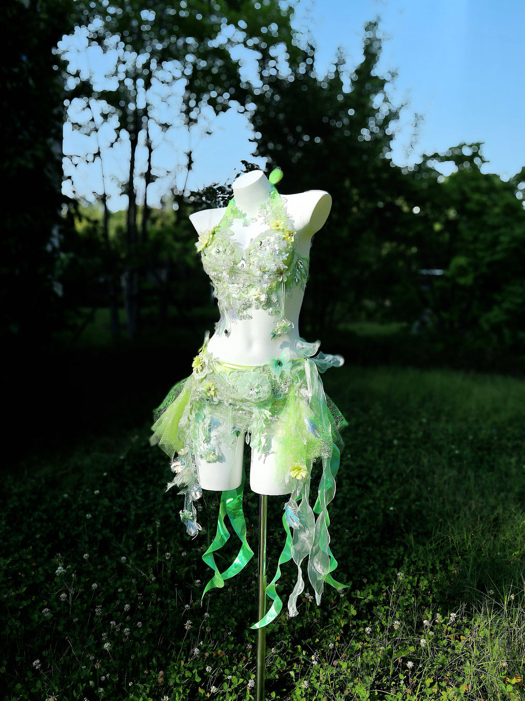 Full-length view of the AVRY New Forest Foxglove fairy festival dress with reflective ribbons and flowing detachable skirt.