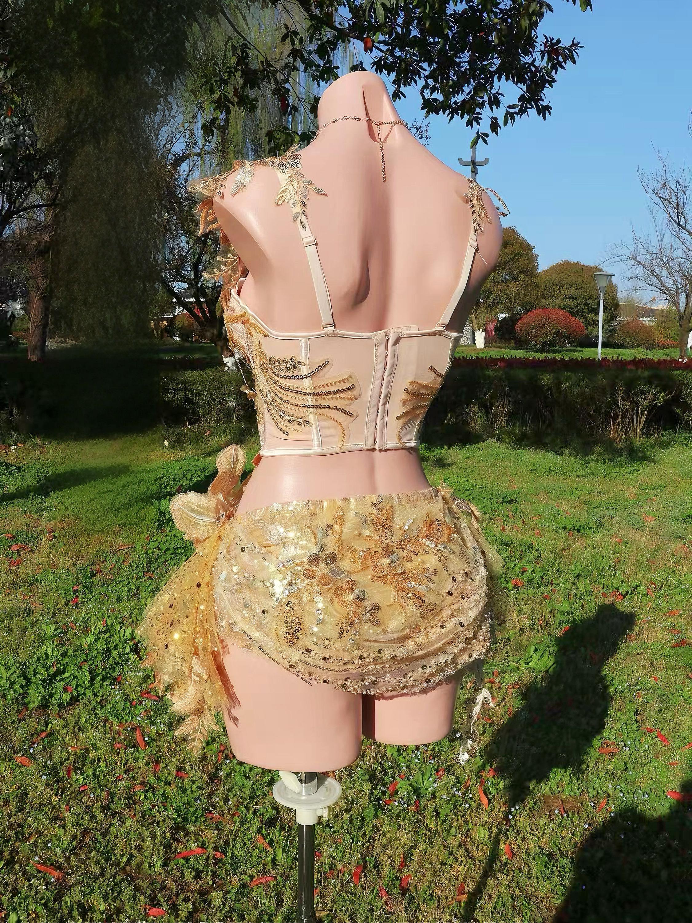 AVRY Rosalind Set full look with gold butterfly fairy outfit, necklace and luminous rave styling.