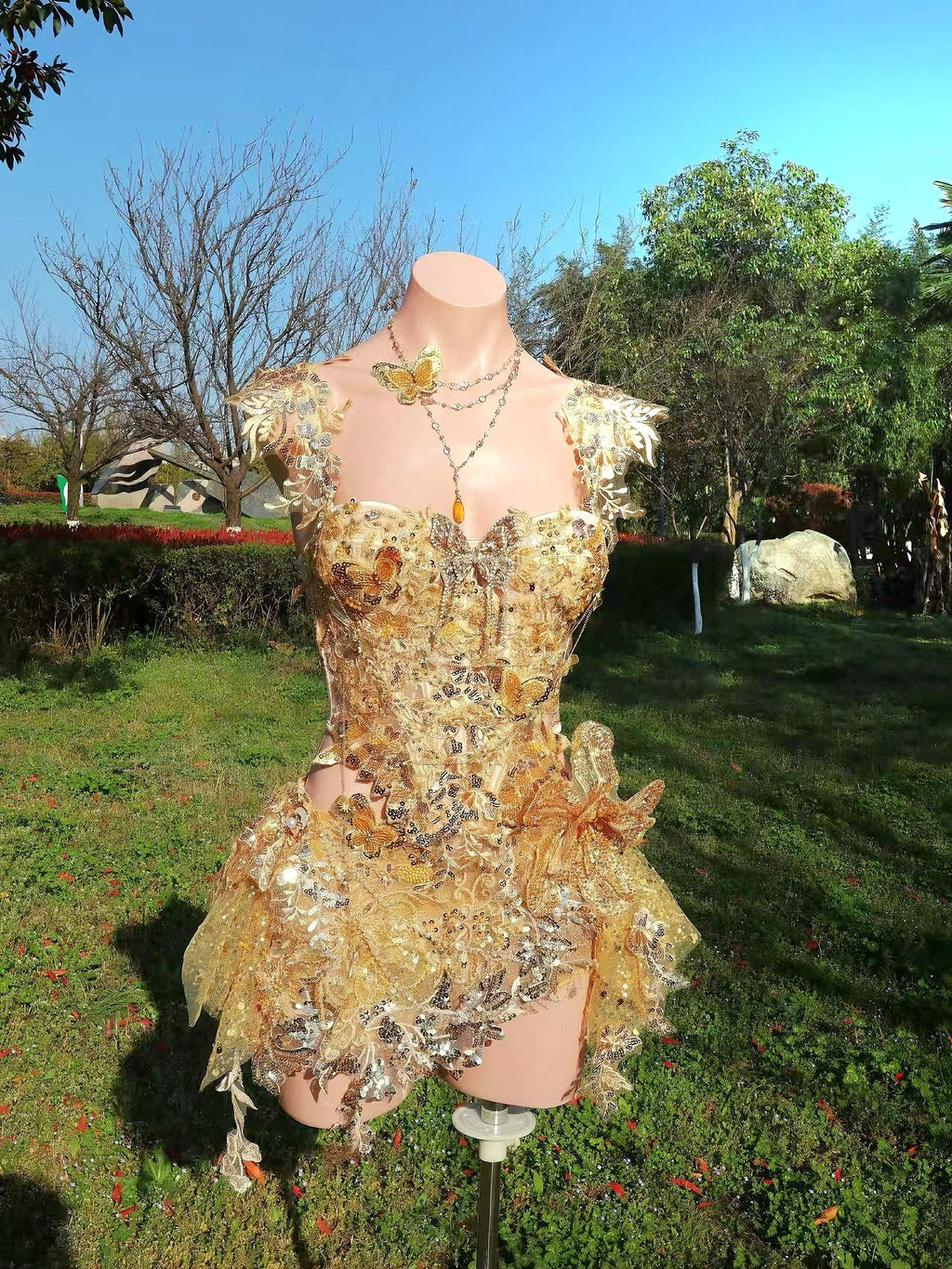 AVRY Rosalind Set back view with golden appliqué details, skirt-short silhouette and fantasy festival styling.