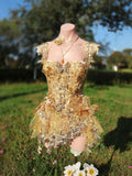 AVRY Rosalind Set gold fairy rave outfit with corset top, skirt-style bottom and layered necklace.