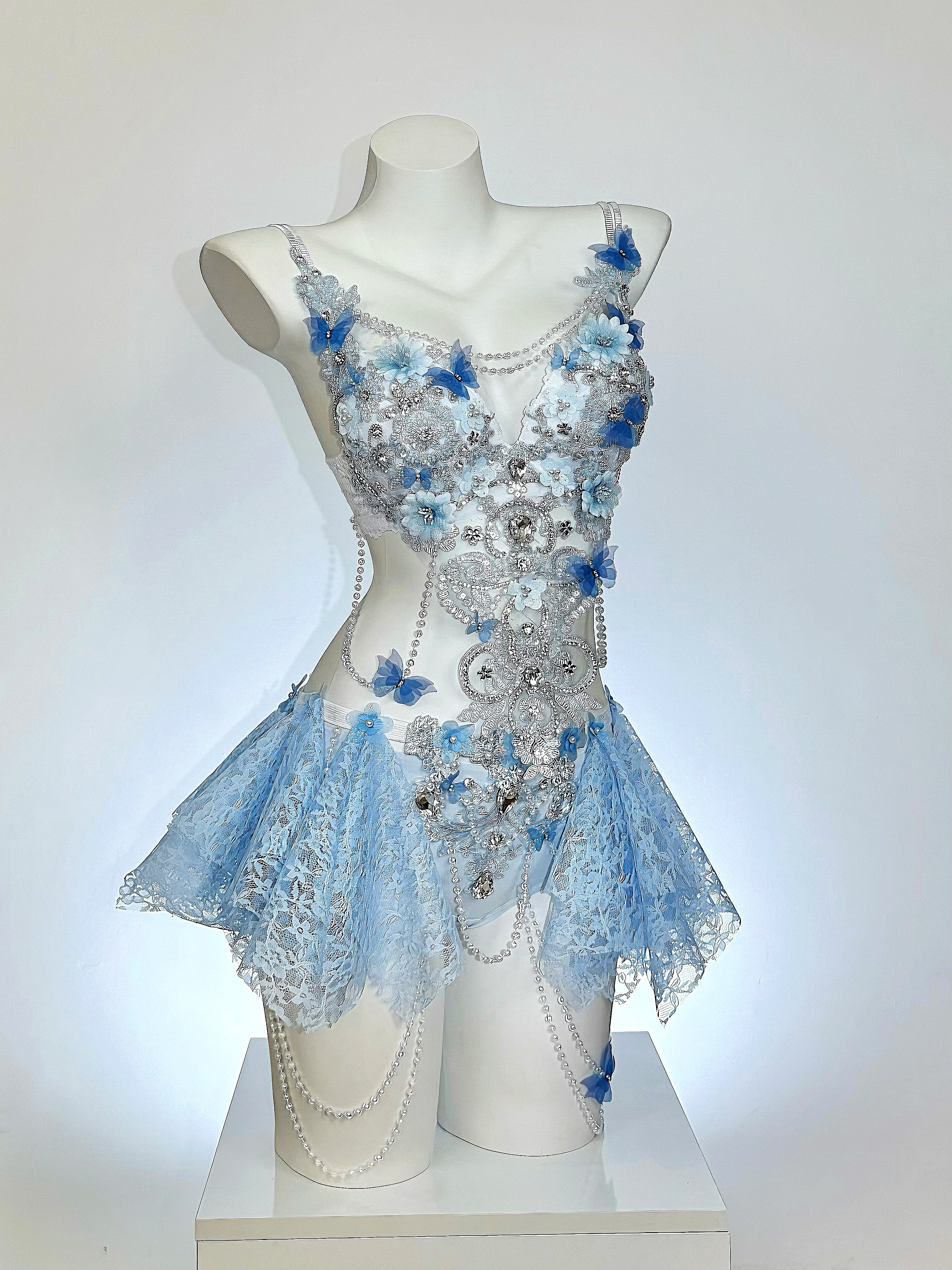 AVRY Seraphina Fiora floral fairy festival outfit in Blue Blossom featuring blue floral appliqués, pearls and crystal embellishments.