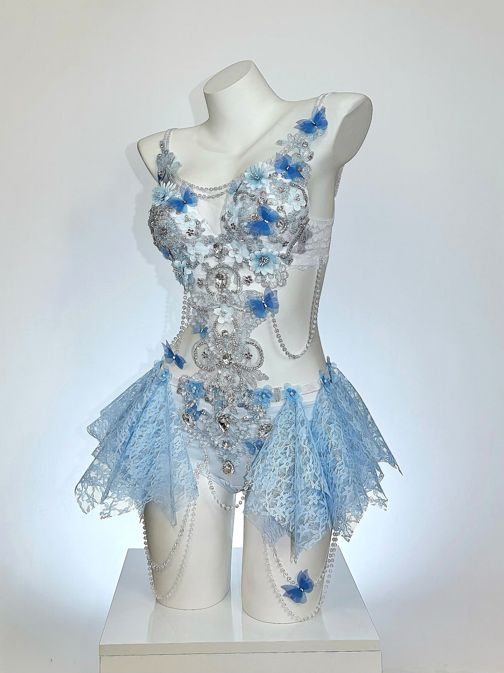 AVRY Seraphina Fiora floral fairy festival outfit in Blue Blossom featuring blue floral appliqués, pearls and crystal embellishments.
