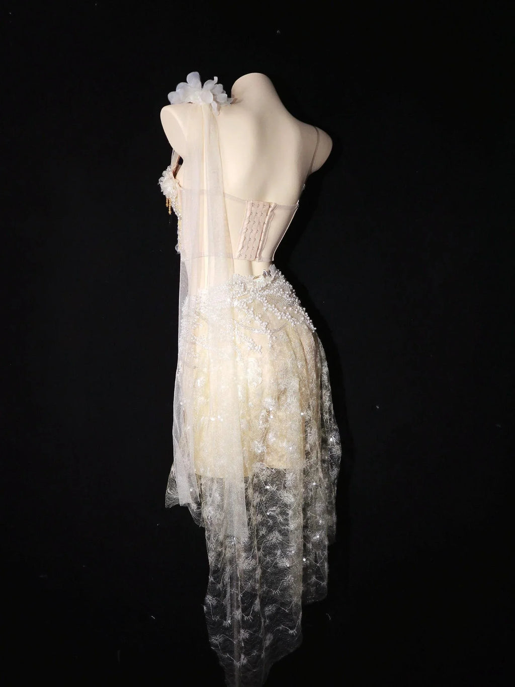AVRY Seraphine Set back view showing sheer shoulder veil, pearl details and lacework festival styling.